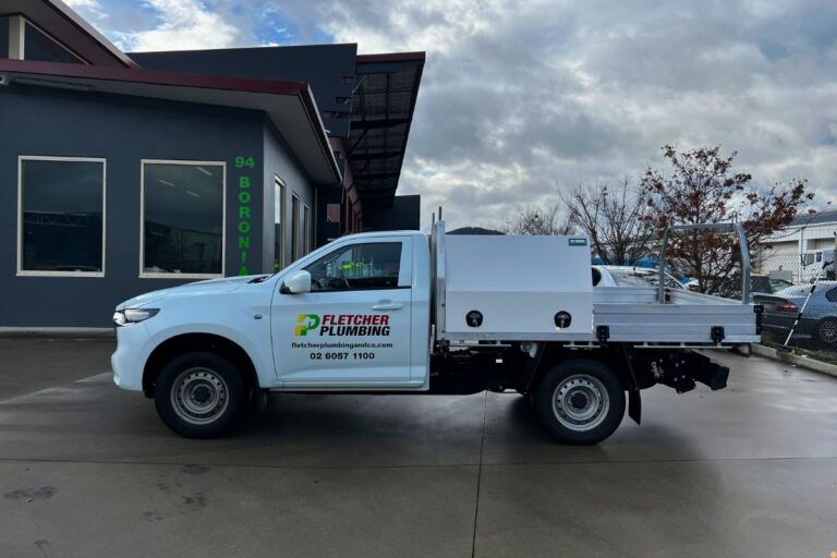 Fletcher Plumbing and Co service vehicle parked outside a commercial building in Albury Wodonga, showcasing local plumbing services