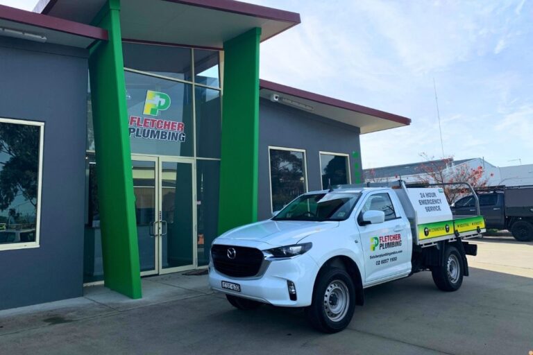 Fletcher Plumbing service ute parked outside the Fletcher Plumbing office in Albury Wodonga, promoting 24 hour emergency plumbing services.